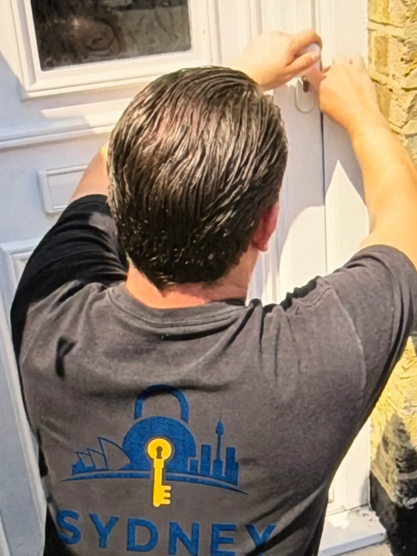 Sydney Locksmith technician opening a front door without damage